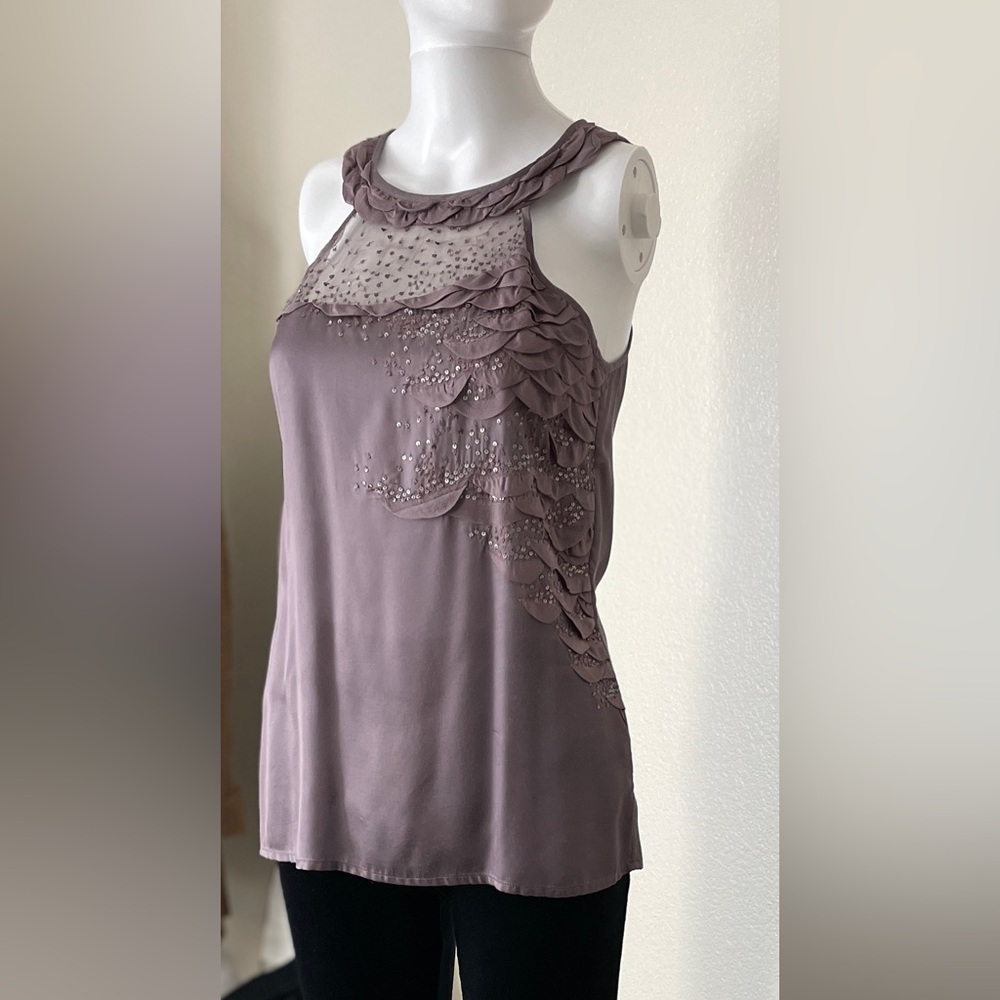 Elegant, sheer sleeveless top with a sequence and scallop layers